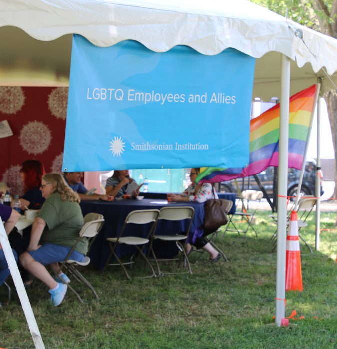 Tent with LGBTQ banner