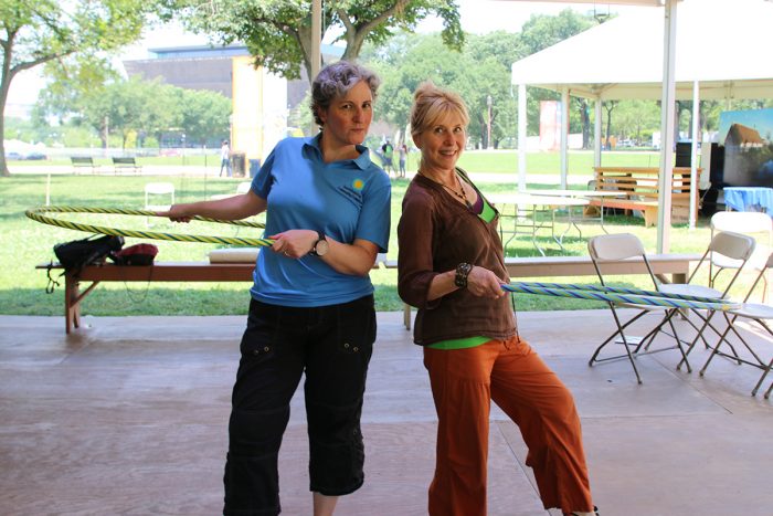 Two women with hula hoops