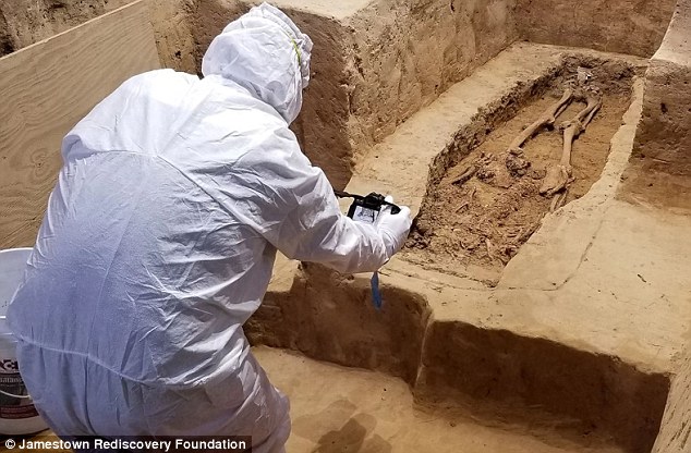 Archaeologist working at grave site