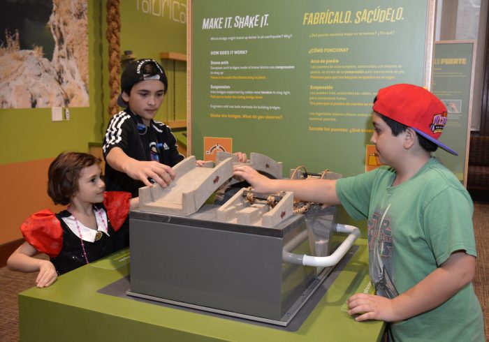 Children building a bridge at interactive station