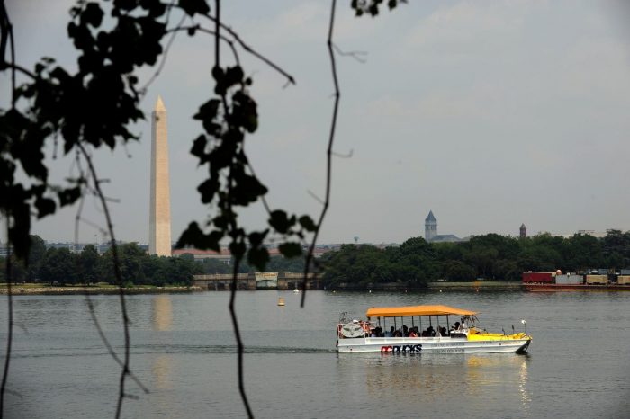 DC Duck boat on Tidal Basin with Washington Monument in background