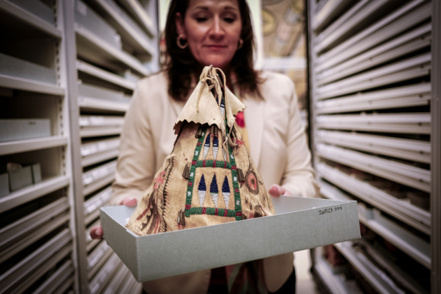 Swift holding Native American artifact