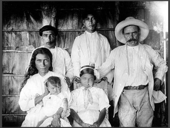 Black and white photo of couple with four children