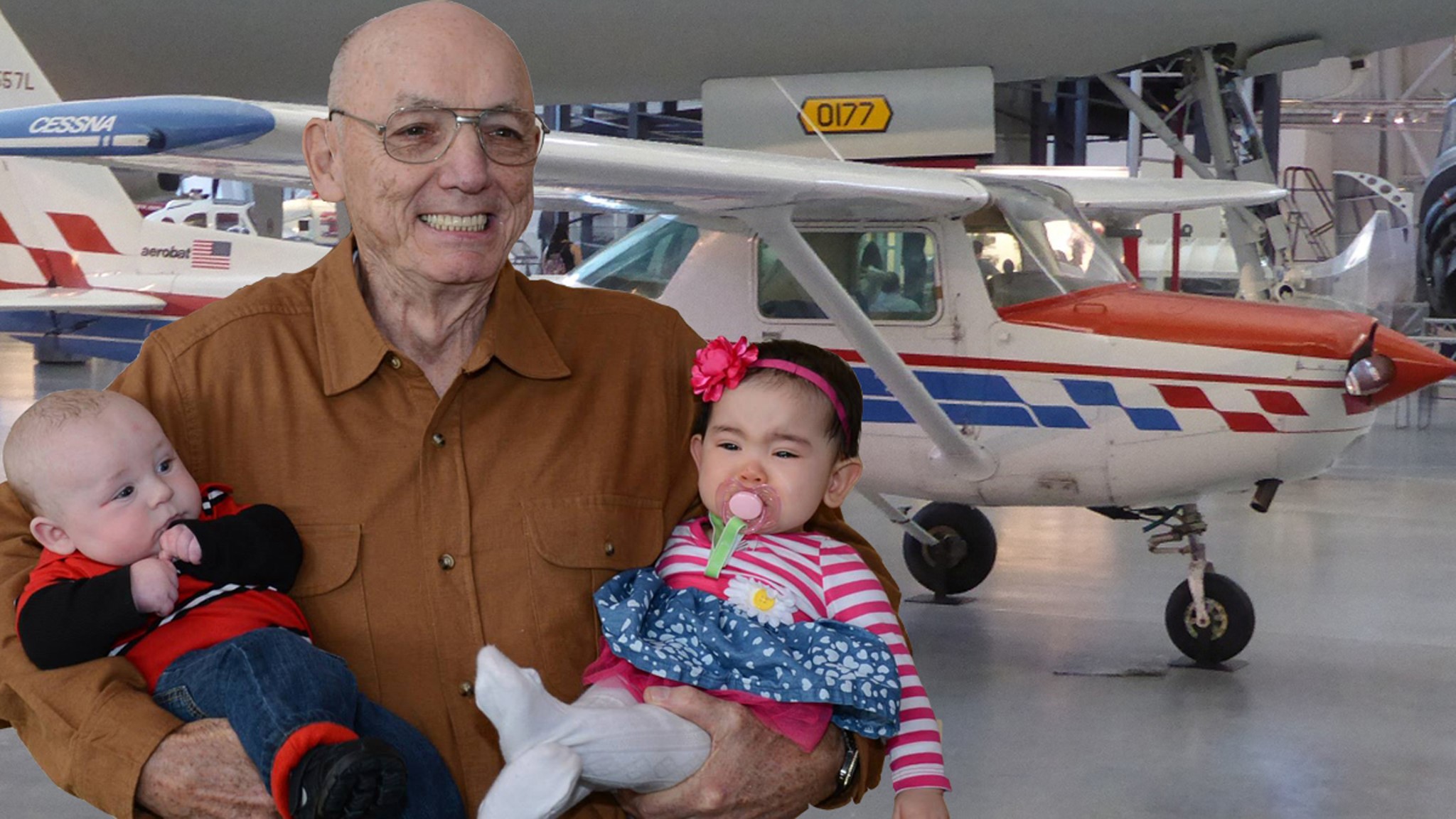 Bob Fish holding two infants