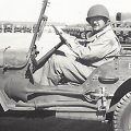 Cropped photo of soldier in jeep
