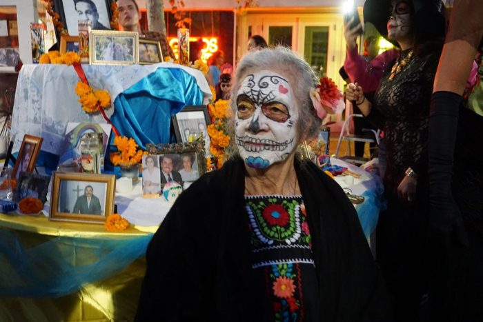 Older woman painted and dressed as Catrina for Day of the Dead