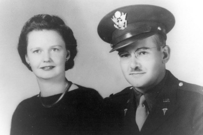 Formal portrait of couple; man in uniform