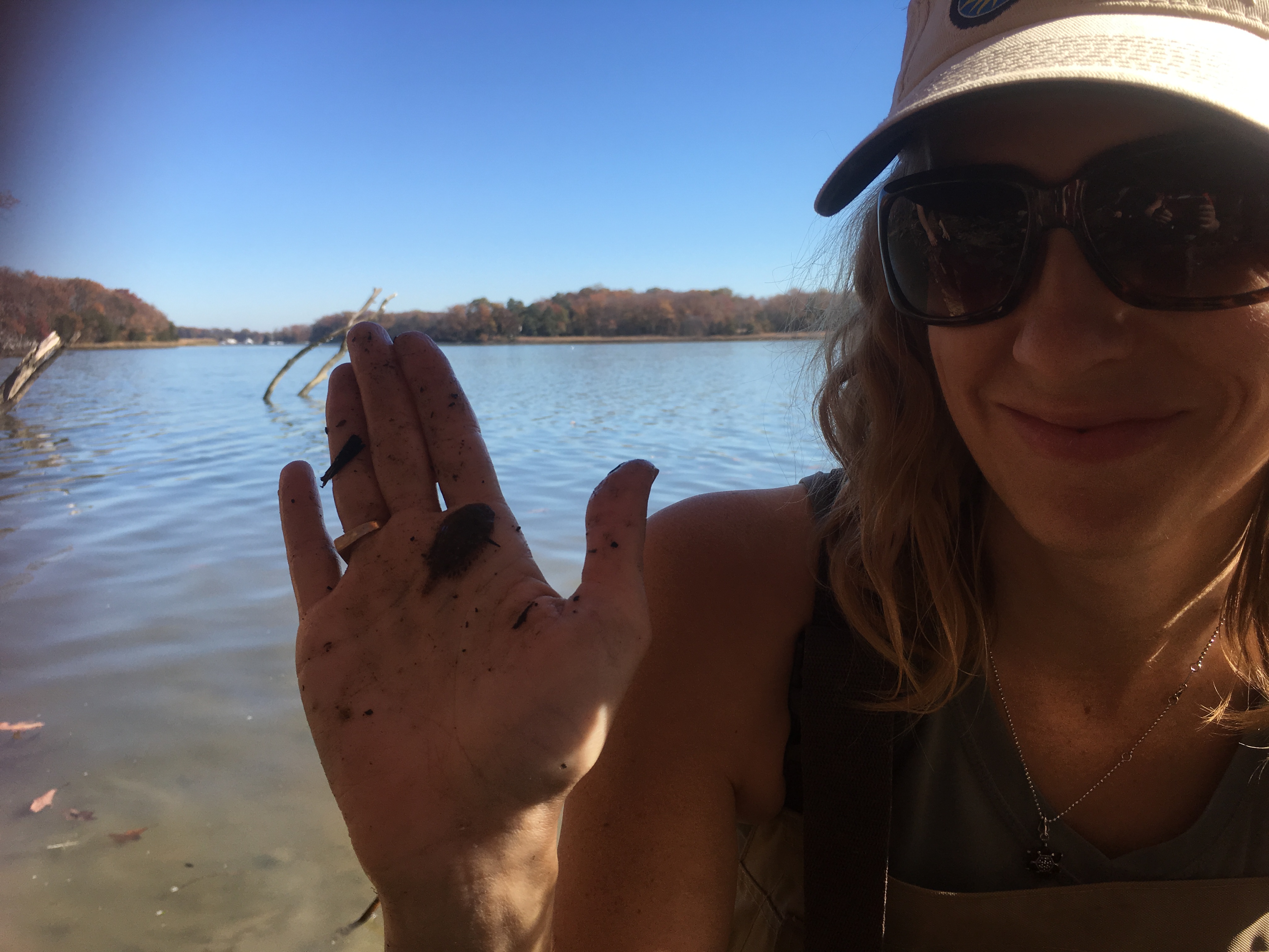 Stacey holds a small fish