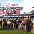 Cropped version of photo showing award recipients at Nationals field