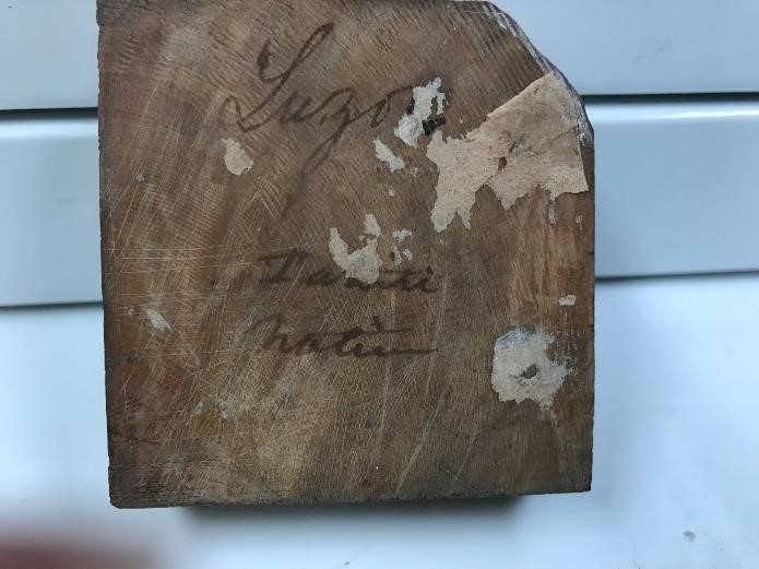 wooden block with writing on it