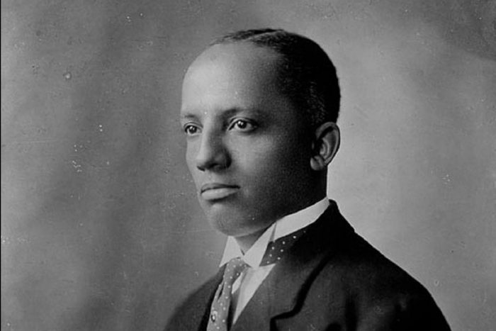 Black and white portrait of Carter G Woodson