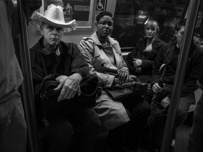 Man in cowboy hat sitting next to African American woman