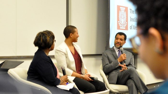 Panelists on stage at the American Institute of Architects