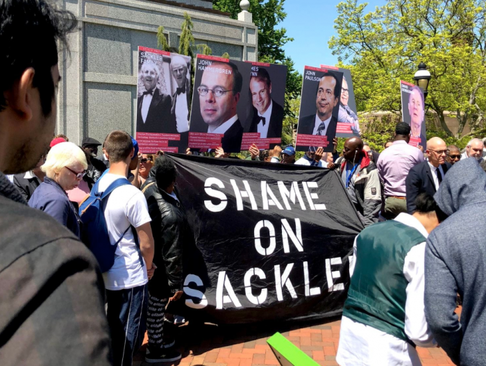 Protesters with Shame on Sackler banner