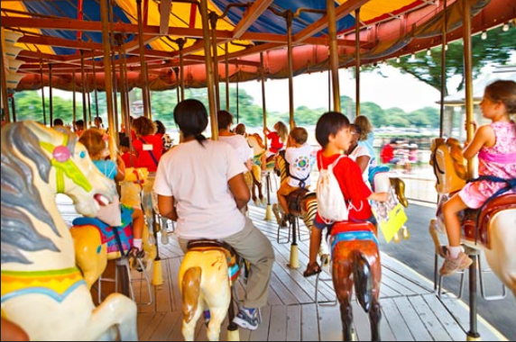 Kids riding carousel