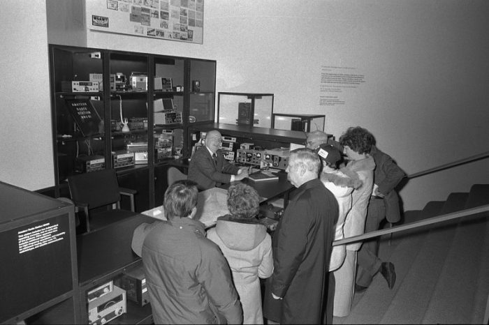 Visitors gather around radio operators