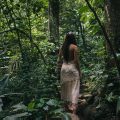 Woman walking in forest