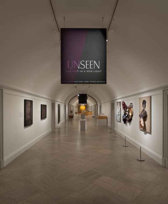 Entrance to exhibition gallery with banner announcing title