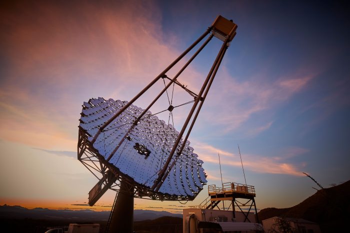 Telescope outlined against twilit sky