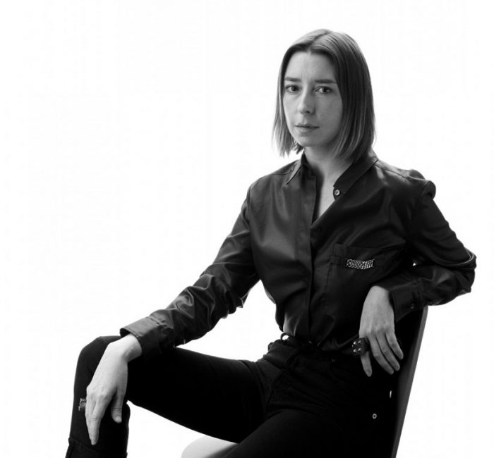 B&W photo of curator against white background