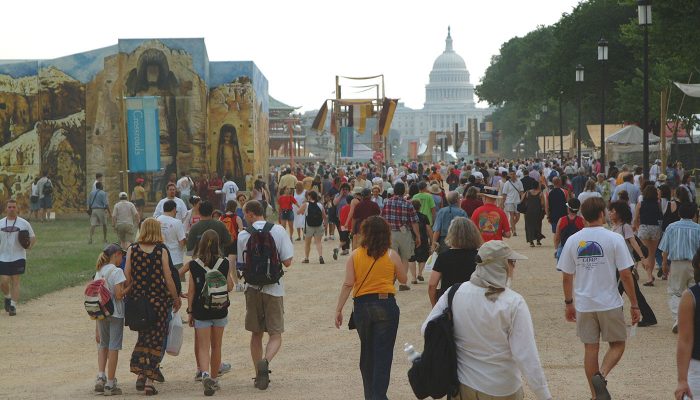 Crowds walking along gravel path on the Mall