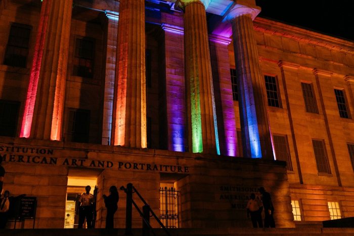 Museum facade lit with colored lights