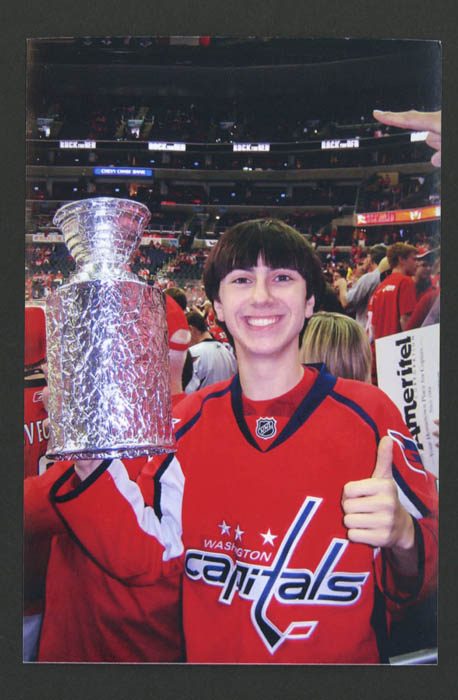 Boy holding replica Stanley Cup