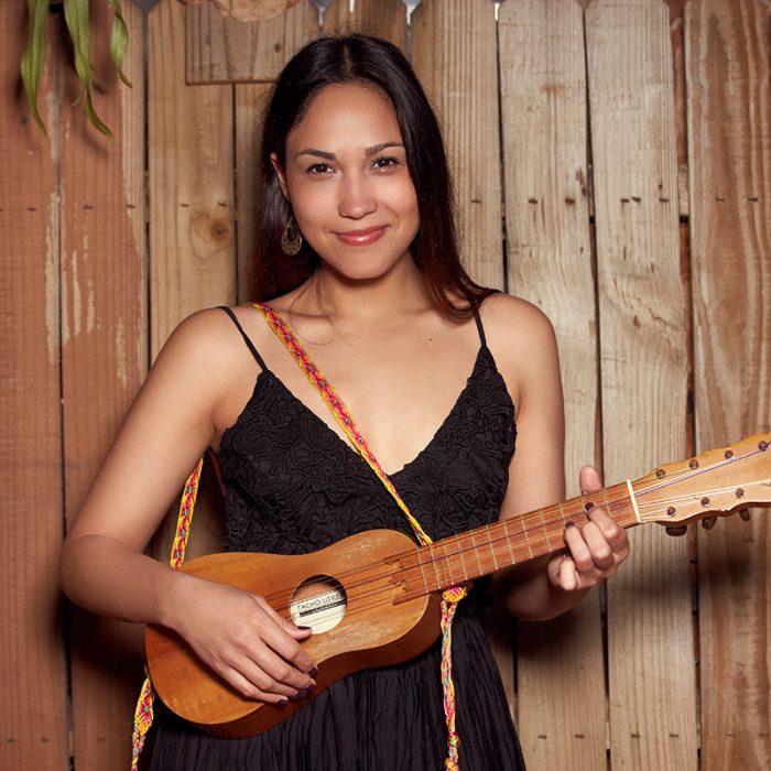 Woman holding small guitar