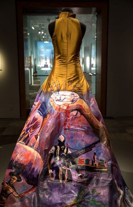 Hand-painted gown showing war scenes