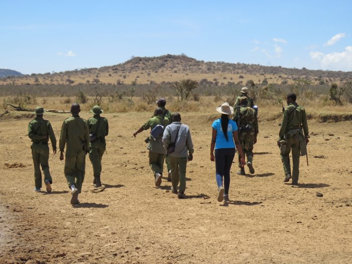 Kamau and rangers photograhed from behind