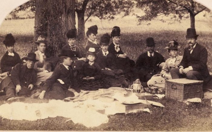 Gentlemen in formal dress at a picnic