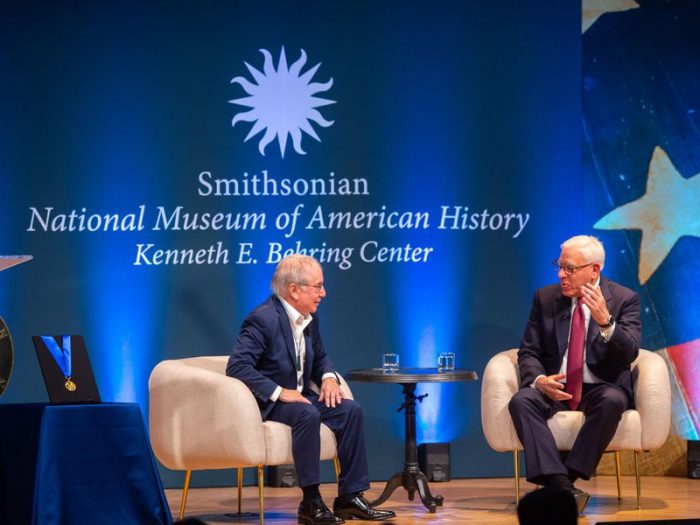 Paul Simon on stage with David Rubenstein