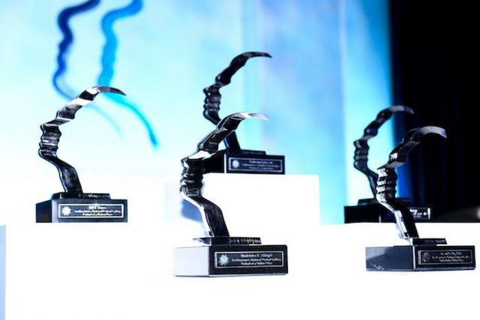 Awards lined up against blue background