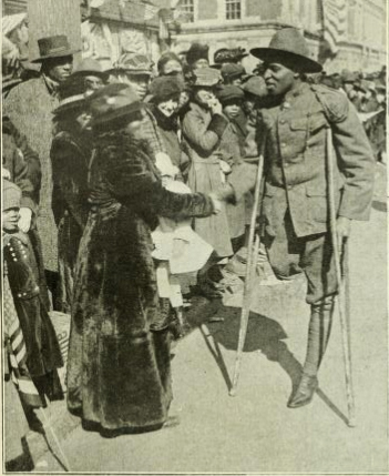 WWI soldier with one leg greeting wellwishers