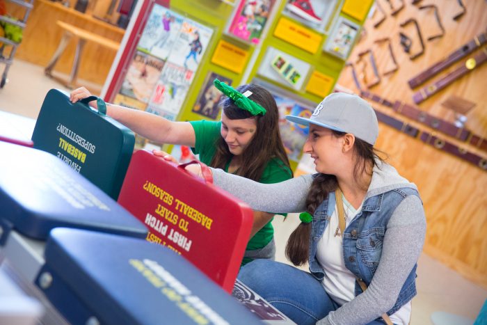 Kids interacting with Hometown Teams exhibit