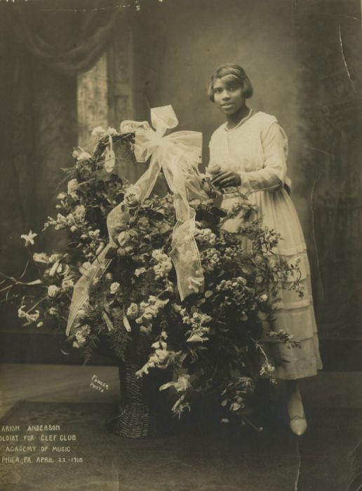 Studio photo of young Marian Anderson with basket of flowers