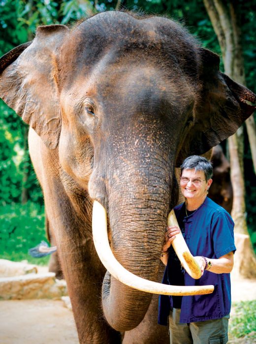 Brown posing with elephant