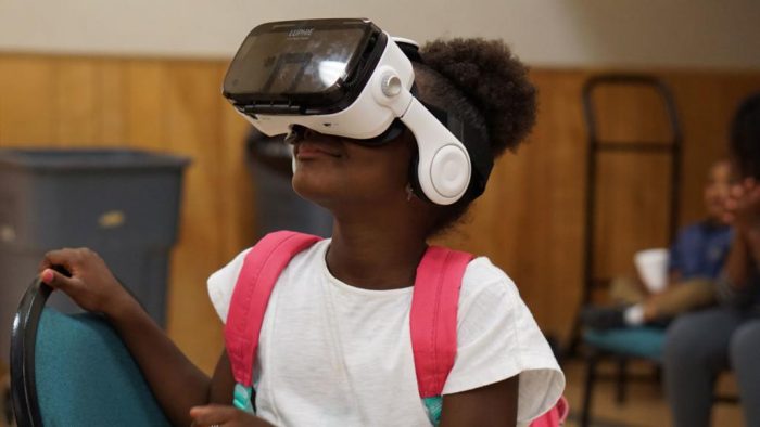 Child wearing VR headset