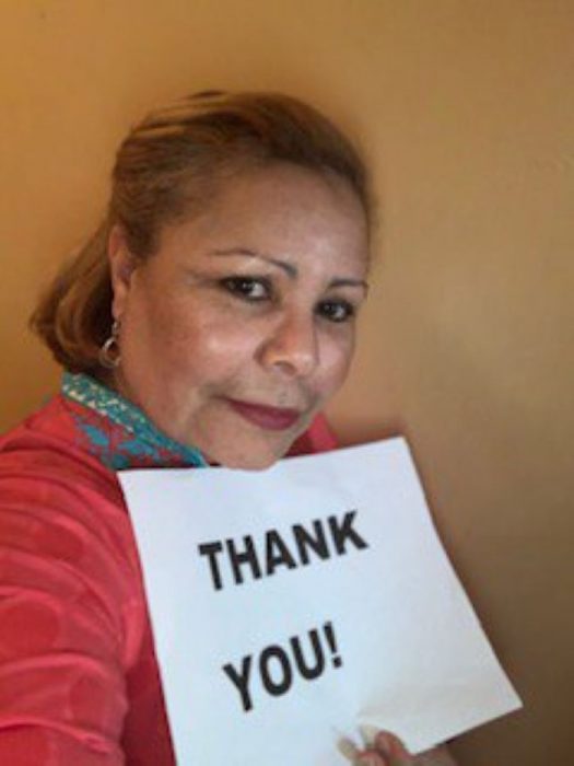 Ada Torres with thank you sign