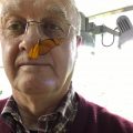 Dan Roe with a butterfly on his nose
