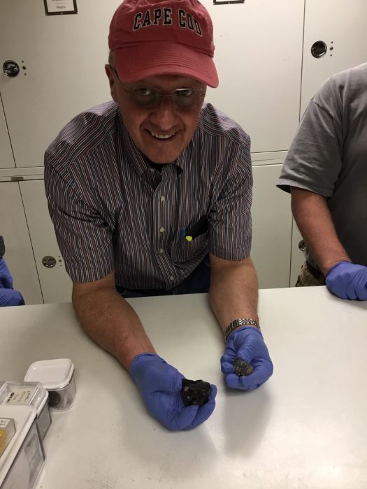 Dan Roe holds meteorites