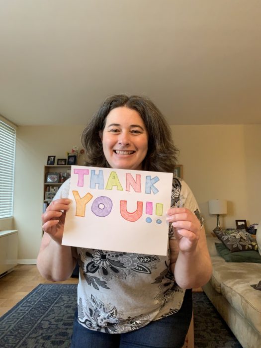 Elisabeth Kilday with thank you sign