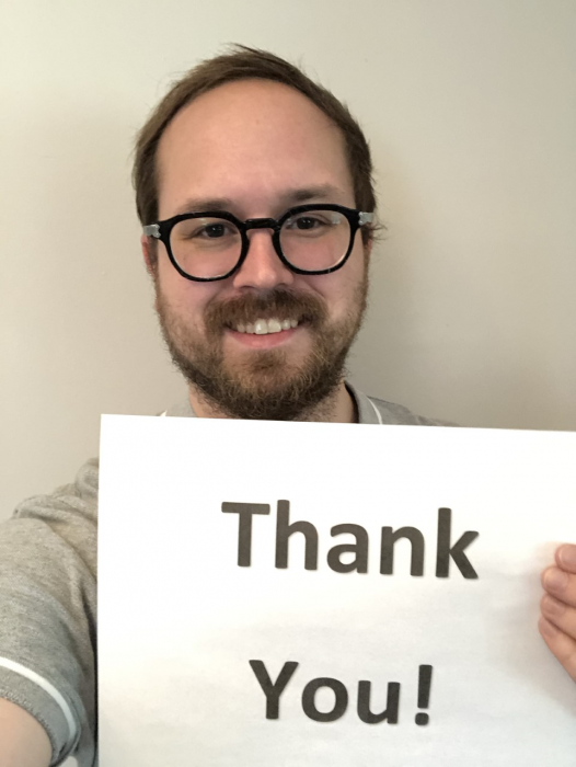 Mark Oberly with thank you sign