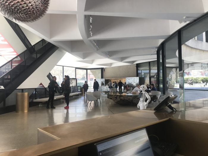 Visitors in Hirshhorn lobby, robot Pepper on the right