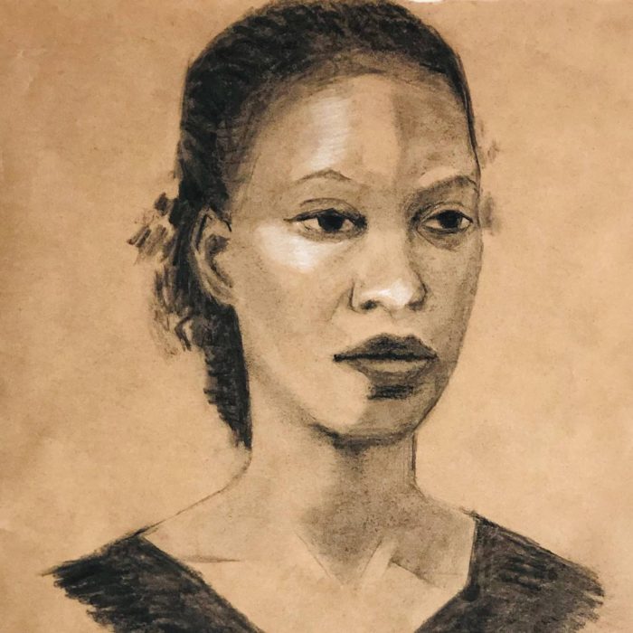 Charcoal portrait of young woman