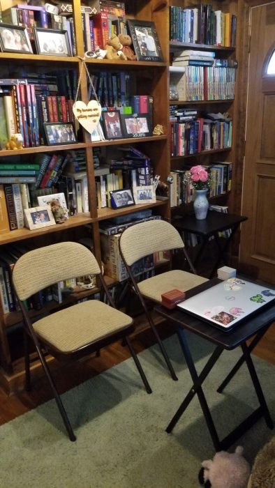 folding chairs in front of a bookcase