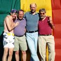Len Hirsch and friends in front of Pride flag