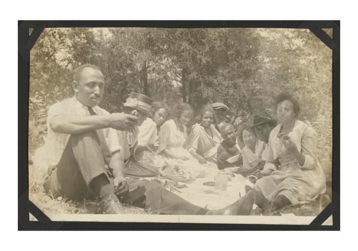 Old photo of black family enjoying a picnic
