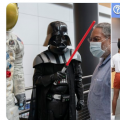 Secretary with volunteers dressed as Star Wars characters