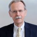 Headshot of Charles Alcock